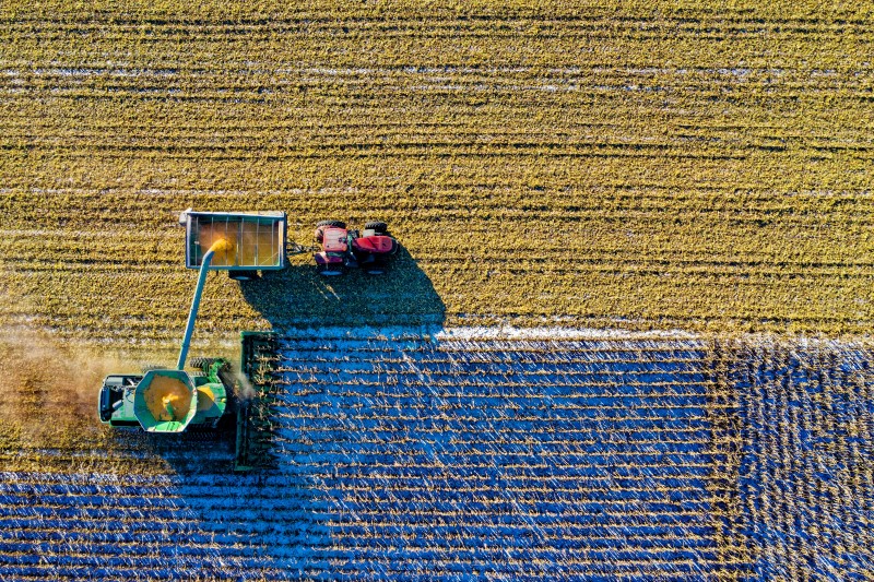 An aerial shot of a field being harvested